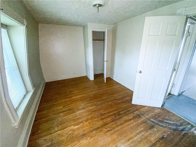 866 Smith St, Rochester, NY 14606 - unfurnished bedroom featuring wood finished floors