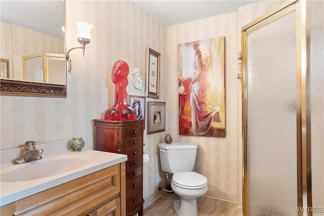 7438 Thunderbird Rd, Clay, NY 13088 - full bath with wallpapered walls, a stall shower, vanity, and wood finished floors