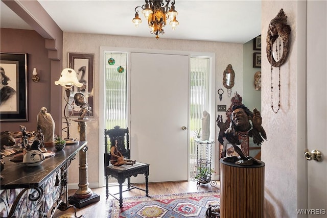 7438 Thunderbird Rd, Clay, NY 13088 - foyer with wood finished floors, healthy amount of natural light, and a chandelier