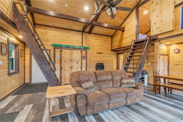 45 Fawn Lake Rd, Orwell, NY 13302 - living room with wooden walls, wooden ceiling, dark wood-style flooring, a ceiling fan, and stairs
