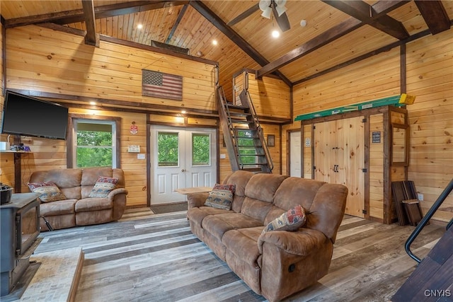 45 Fawn Lake Rd, Orwell, NY 13302 - living room featuring a wooden ceiling with exposed beams, wood walls, wood-type flooring, high vaulted ceiling, and a wood stove