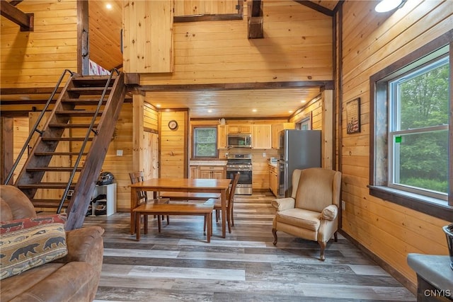 45 Fawn Lake Rd, Orwell, NY 13302 - dining area with wood walls, wood finished floors, stairs, and recessed lighting