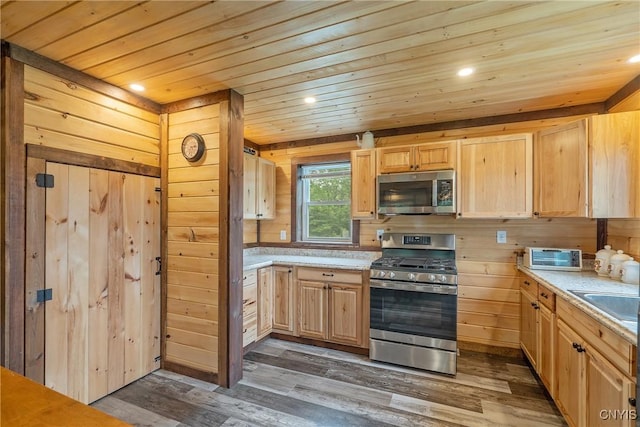45 Fawn Lake Rd, Orwell, NY 13302 - kitchen with appliances with stainless steel finishes, light brown cabinetry, light countertops, dark wood-type flooring, and recessed lighting