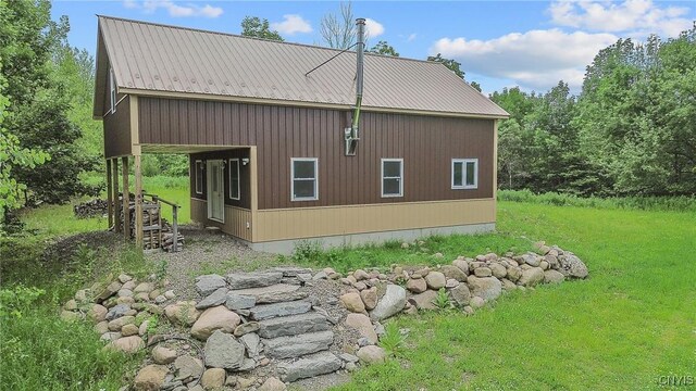 45 Fawn Lake Rd, Orwell, NY 13302 - view of home's exterior featuring a metal roof and a lawn