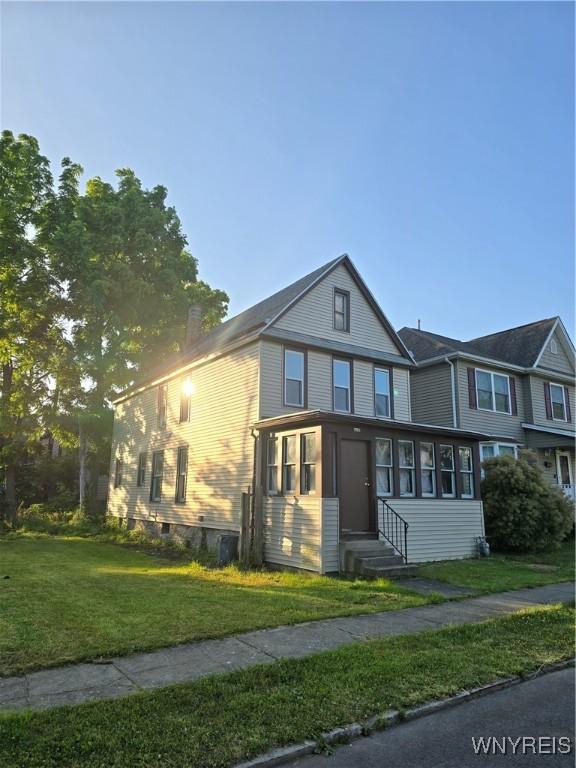 273 Purdy St, Buffalo, NY 14208 - view of front of property with entry steps and a front lawn
