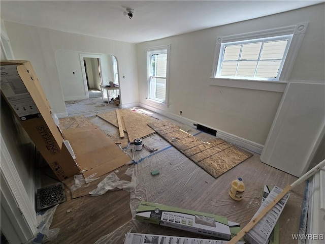 273 Purdy St, Buffalo, NY 14208 - unfurnished living room with wood finished floors and arched walkways