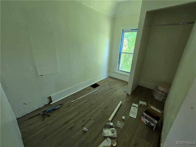 273 Purdy St, Buffalo, NY 14208 - unfurnished bedroom featuring wood finished floors and vaulted ceiling