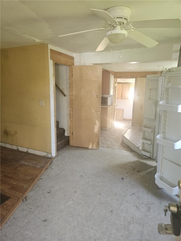 405 Balsam St, Elmira City, NY 14904 - unfurnished living room with a ceiling fan and stairs