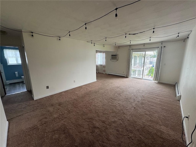 6084/4 Brockport Spencerport Rd Unit 4, Sweden, NY 14420 - spare room with a baseboard heating unit, carpet floors, and a wall mounted AC