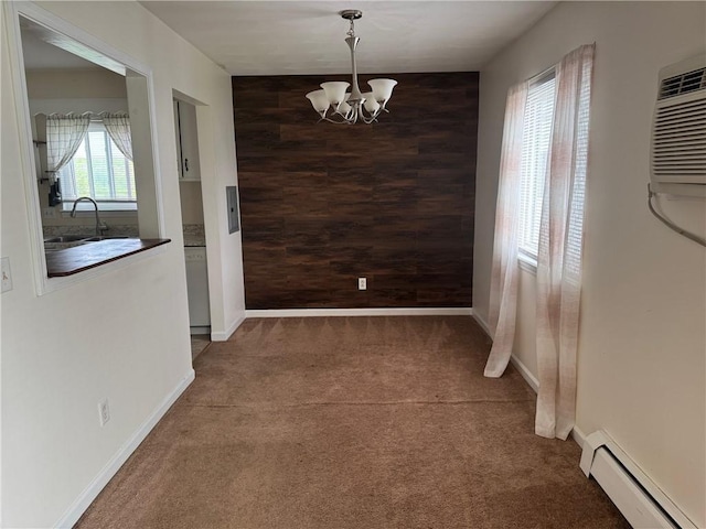 6084/4 Brockport Spencerport Rd Unit 4, Sweden, NY 14420 - unfurnished dining area with a baseboard radiator, a chandelier, carpet floors, plenty of natural light, and wooden walls