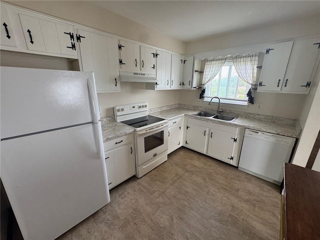 6084/4 Brockport Spencerport Rd Unit 4, Sweden, NY 14420 - kitchen with white appliances, under cabinet range hood, tile patterned floors, light countertops, and white cabinets