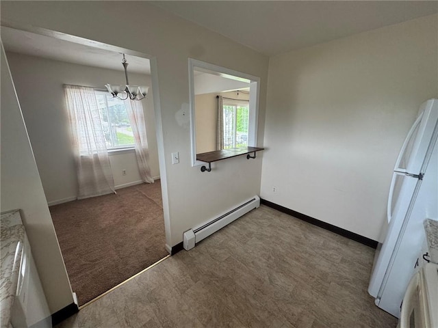 6084/4 Brockport Spencerport Rd Unit 4, Sweden, NY 14420 - unfurnished dining area with baseboard heating and a chandelier