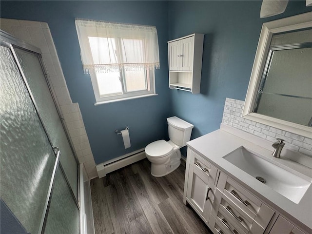 6084/4 Brockport Spencerport Rd Unit 4, Sweden, NY 14420 - full bath with a baseboard radiator, vanity, a shower with door, and wood finished floors