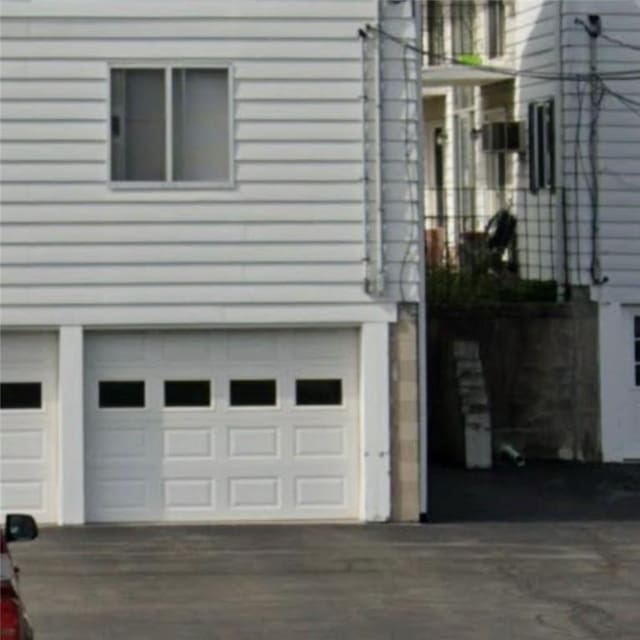 6084/4 Brockport Spencerport Rd Unit 4, Sweden, NY 14420 - view of side of home featuring a garage