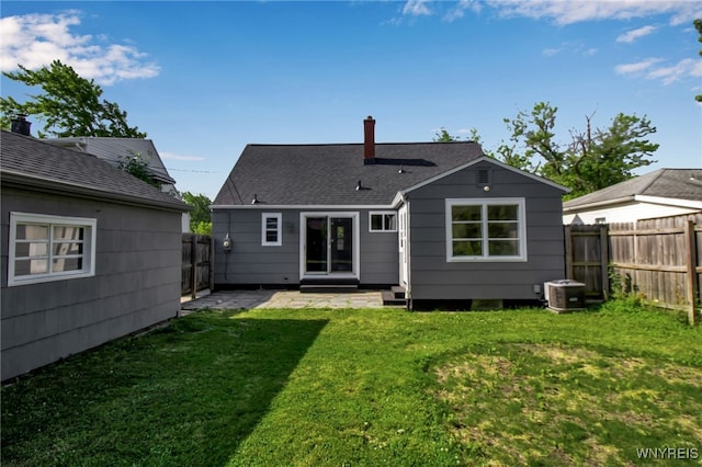 295 Westchester Blvd, Tonawanda-Town, NY 14217 - back of property with a fenced backyard, a patio area, a chimney, and roof with shingles