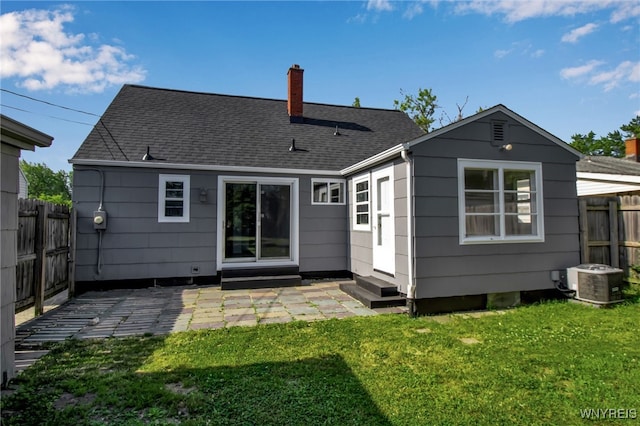 295 Westchester Blvd, Tonawanda-Town, NY 14217 - back of house featuring entry steps, a chimney, a fenced backyard, a patio, and a shingled roof