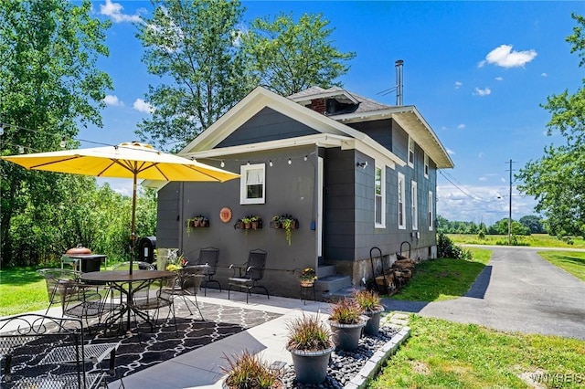 3121 Maple Rd, Wilson, NY 14108 - back of property with a patio