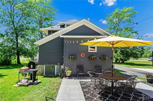 3121 Maple Rd, Wilson, NY 14108 - rear view of property featuring a lawn