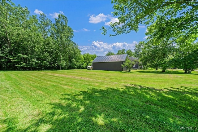 3121 Maple Rd, Wilson, NY 14108 - view of green lawn featuring an outbuilding