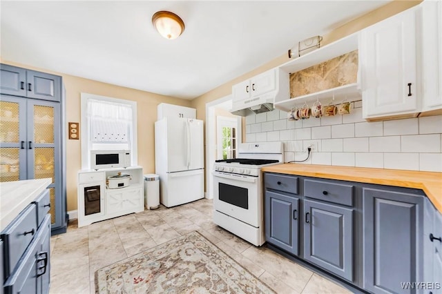 3121 Maple Rd, Wilson, NY 14108 - kitchen with white appliances, wooden counters, tasteful backsplash, under cabinet range hood, and white cabinets