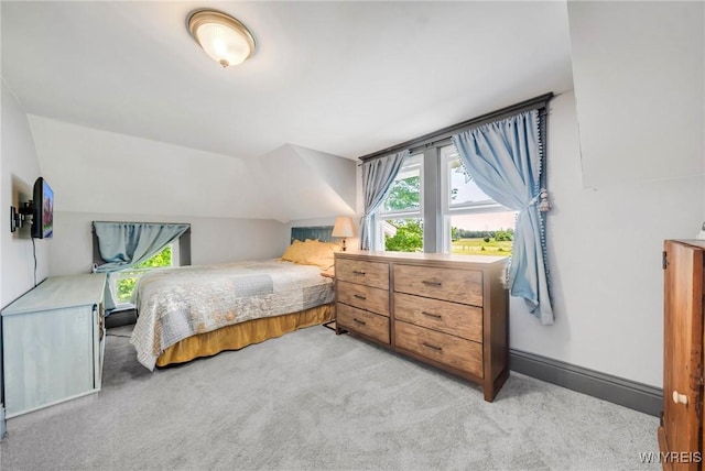 3121 Maple Rd, Wilson, NY 14108 - bedroom with light carpet and vaulted ceiling