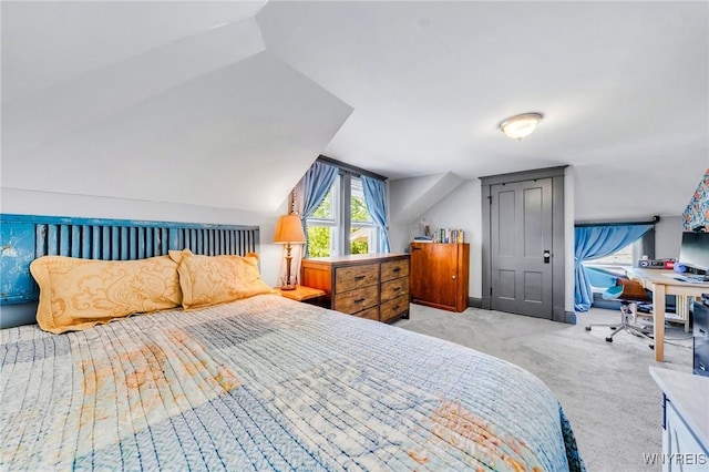 3121 Maple Rd, Wilson, NY 14108 - carpeted bedroom featuring a desk and vaulted ceiling