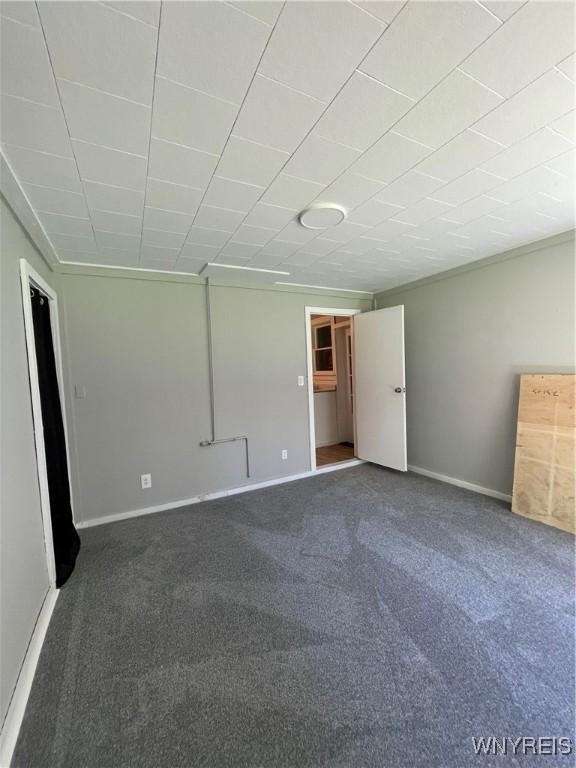43 Union St, Collins, NY 14070 - unfurnished bedroom with dark colored carpet
