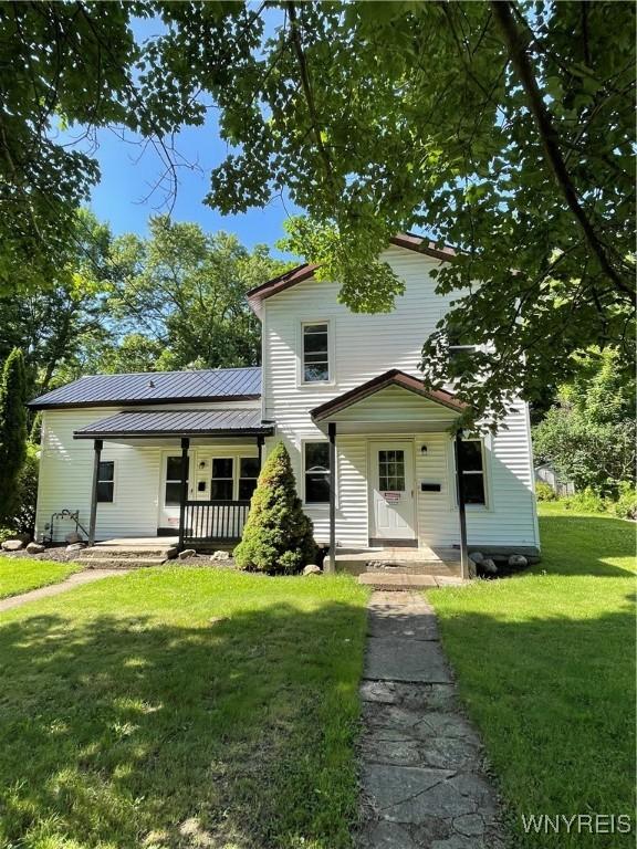 43 Union St, Collins, NY 14070 - traditional-style house with a front yard, a metal roof, and a porch