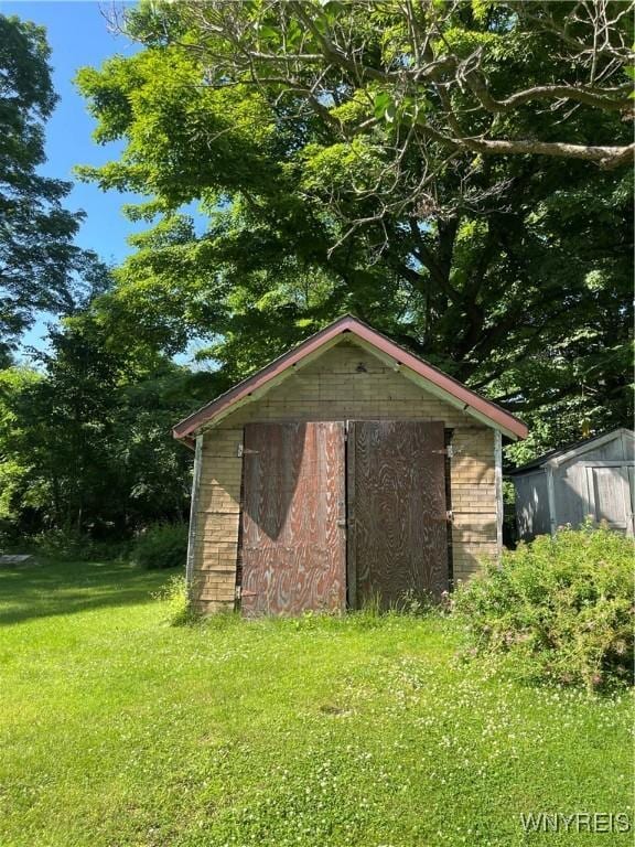 43 Union St, Collins, NY 14070 - view of property exterior with a shed and a yard