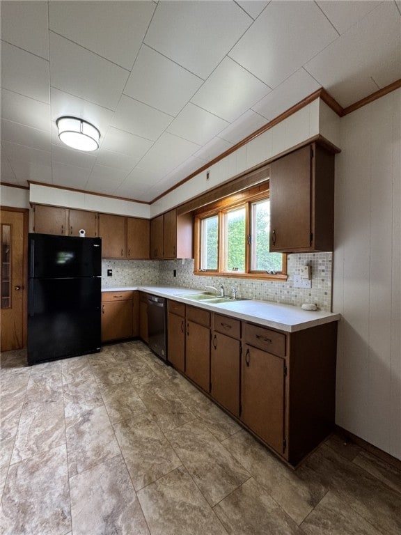 519 N Elk Ave, Kane Boro, PA 16735 - kitchen featuring freestanding refrigerator, dishwasher, light countertops, ornamental molding, and decorative backsplash