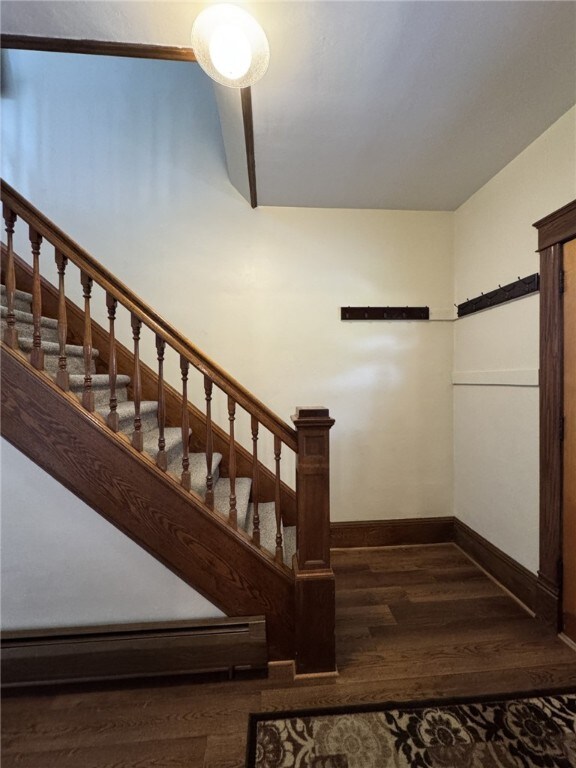 519 N Elk Ave, Kane Boro, PA 16735 - staircase featuring a baseboard radiator and wood finished floors