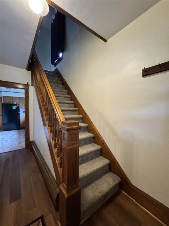 519 N Elk Ave, Kane Boro, PA 16735 - stairway featuring wood finished floors and a baseboard heating unit