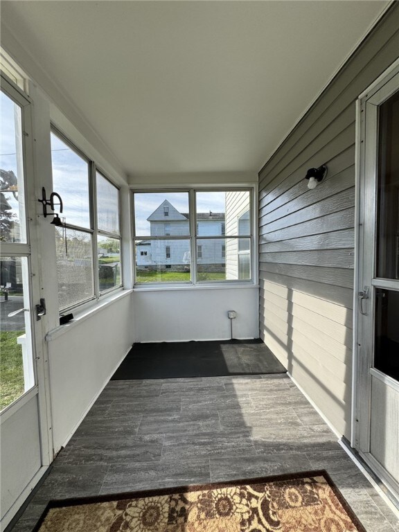 519 N Elk Ave, Kane Boro, PA 16735 - unfurnished sunroom with plenty of natural light and wood finished floors