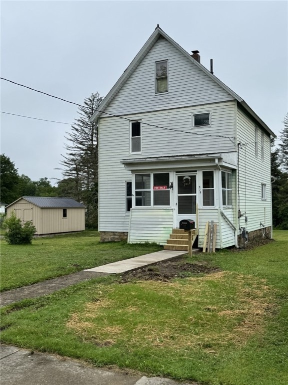 519 N Elk Ave, Kane Boro, PA 16735 - view of front facade with entry steps, a front yard, and a chimney