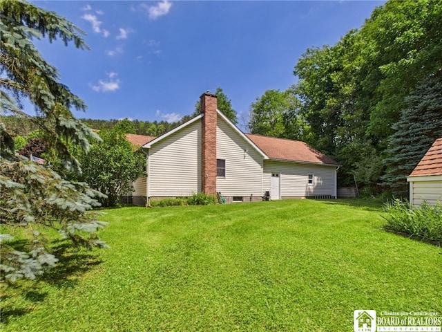 1501 Windfall Rd, Olean, NY 14760 - view of side of home with a chimney and a yard