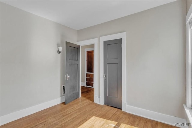 592 Parkside Ave, Buffalo, NY 14216 - unfurnished bedroom featuring baseboards and light wood-style floors