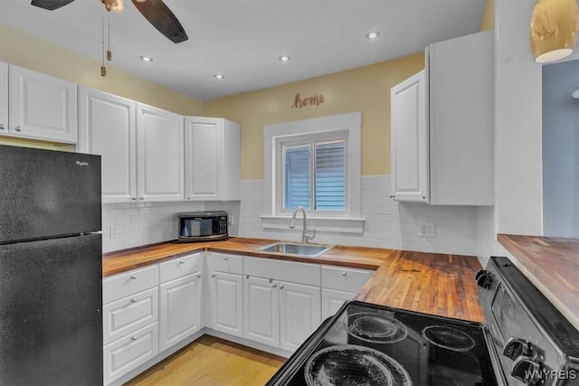 592 Parkside Ave, Buffalo, NY 14216 - kitchen featuring black appliances, wood counters, white cabinetry, ceiling fan, and recessed lighting
