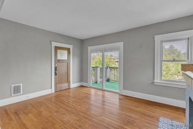 592 Parkside Ave, Buffalo, NY 14216 - spare room featuring baseboards and light wood finished floors