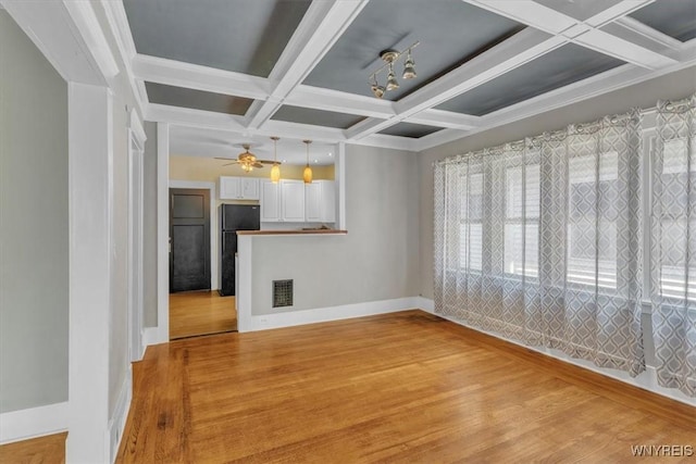 592 Parkside Ave, Buffalo, NY 14216 - unfurnished living room with coffered ceiling, light wood-style flooring, beam ceiling, and ceiling fan