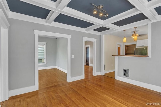 592 Parkside Ave, Buffalo, NY 14216 - unfurnished living room with coffered ceiling, beam ceiling, and light wood-type flooring