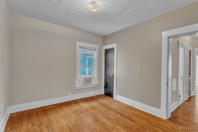 592 Parkside Ave, Buffalo, NY 14216 - empty room featuring cooling unit and light wood-style floors