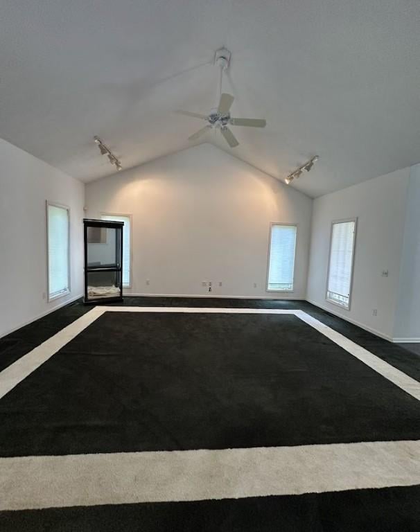 80 Endicar Dr, Irondequoit, NY 14622 - spare room featuring track lighting, dark carpet, lofted ceiling, and ceiling fan