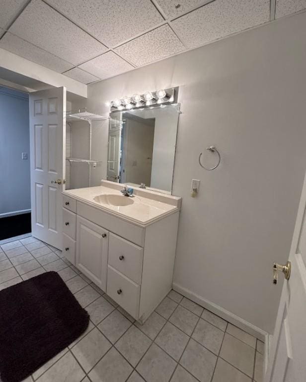 80 Endicar Dr, Irondequoit, NY 14622 - bathroom with tile patterned flooring, vanity, and a paneled ceiling