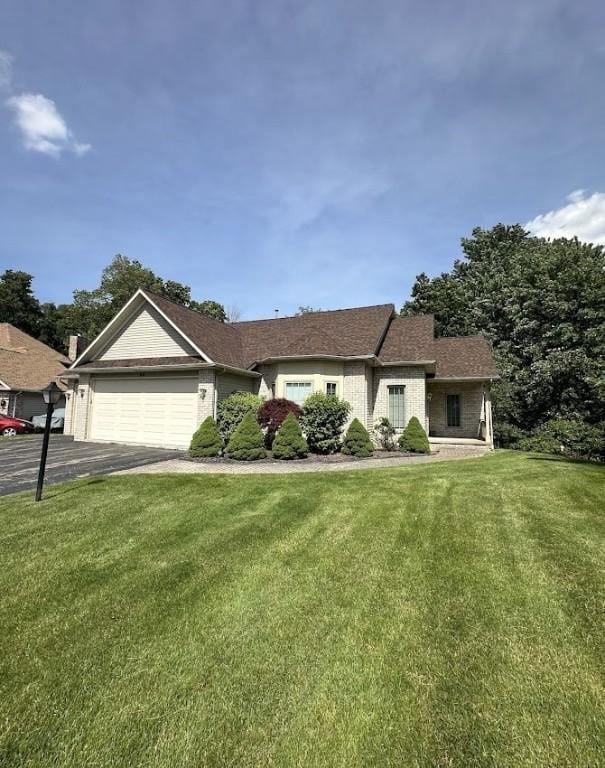80 Endicar Dr, Irondequoit, NY 14622 - ranch-style house featuring a garage, a front lawn, and asphalt driveway