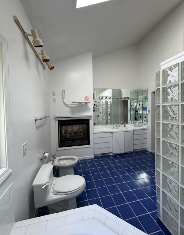 80 Endicar Dr, Irondequoit, NY 14622 - full bathroom with a bidet, walk in shower, vanity, and tile patterned floors