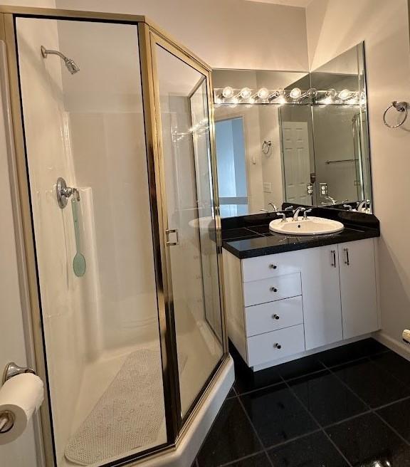 80 Endicar Dr, Irondequoit, NY 14622 - full bathroom with a stall shower, tile patterned flooring, and vanity