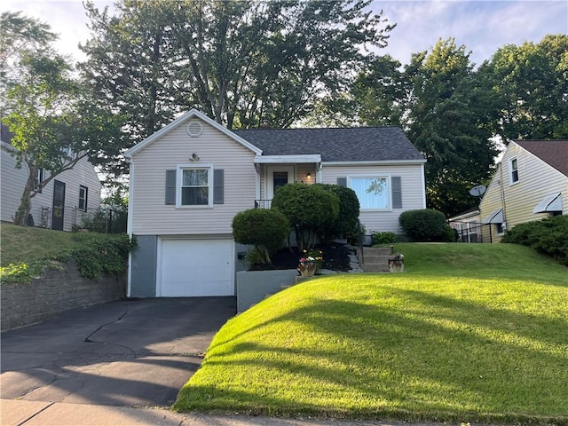 584 Falstaff Rd, Irondequoit, NY 14609 - view of front facade featuring a front lawn, asphalt driveway, an attached garage, and a shingled roof