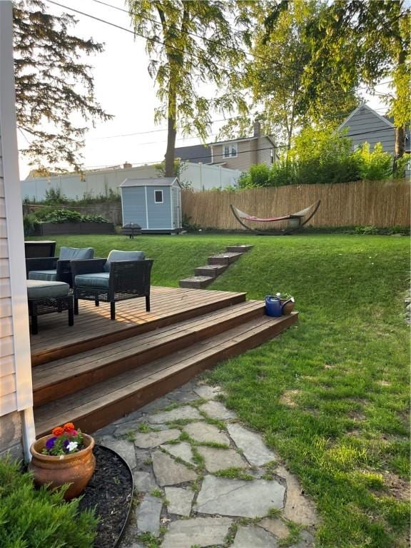 584 Falstaff Rd, Irondequoit, NY 14609 - view of yard featuring a storage unit and a wooden deck