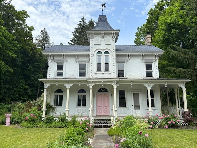 35799 State Highway 10, Hamden, NY 13782 - view of front facade with covered porch, a chimney, and a front yard