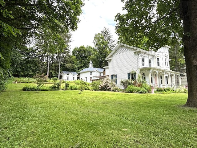 35799 State Highway 10, Hamden, NY 13782 - view of home's exterior featuring covered porch and a yard